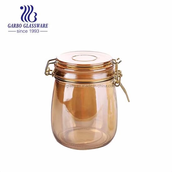 500 ml 700 ml Diseño de tarro de vidrio con revestimiento de hierro electrónico de grado alimenticio Frascos de almacenamiento de vidrio Manson de color dorado con tapa hermética con abrazadera para miel, alimentos secos, pasta, especias